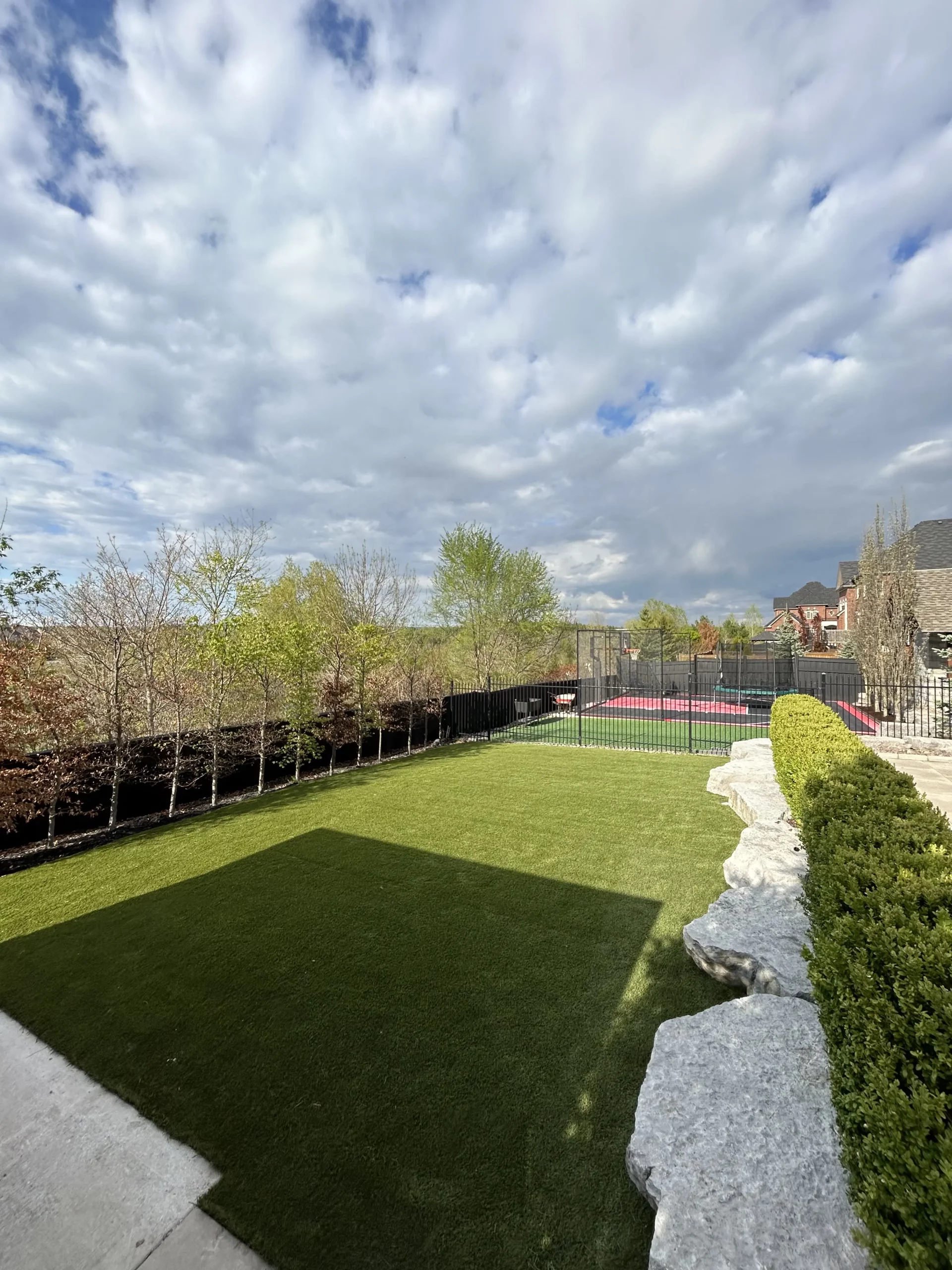 Backyard artificial turf installation in Caledon