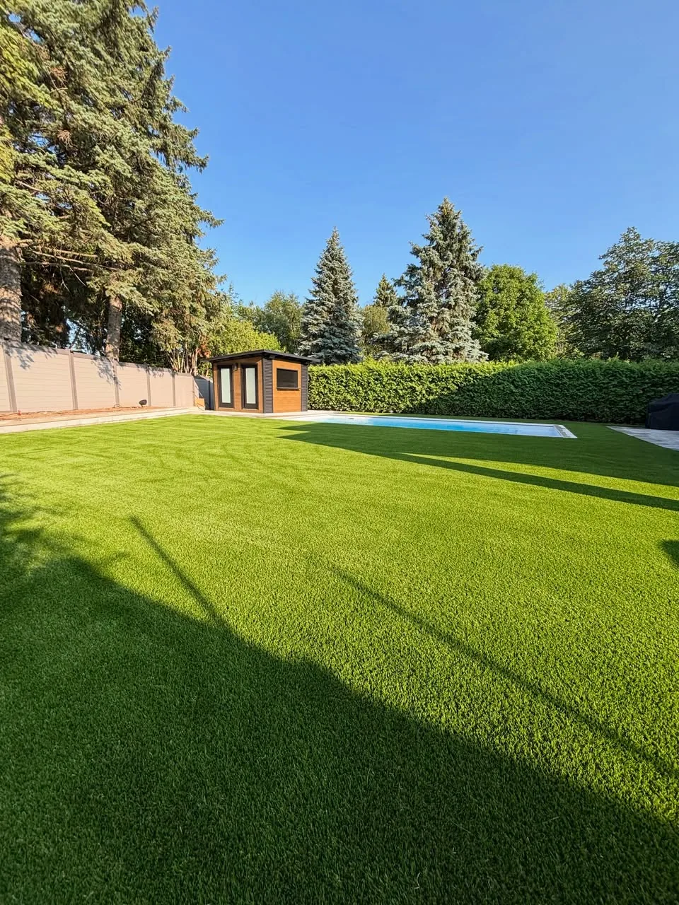 Wide artificial grass lawn installation in Caledon